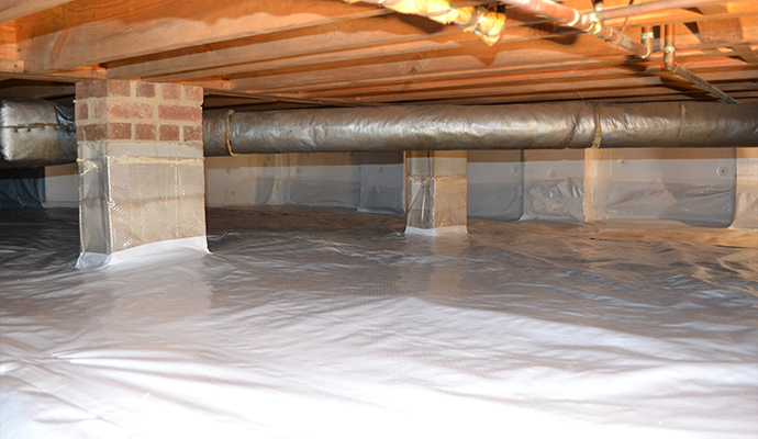 Waterproofed crawl space with vapor barrier