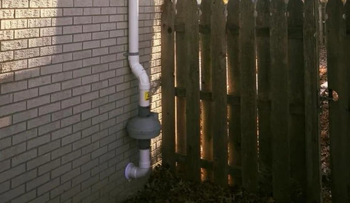 Installed radon mitigation device