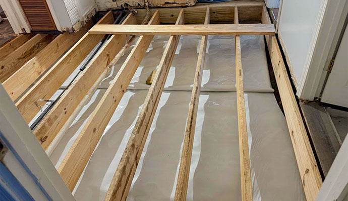 Repaired wooden floor joists