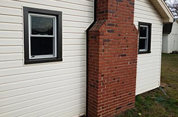 Chimney separated and leaning out from house