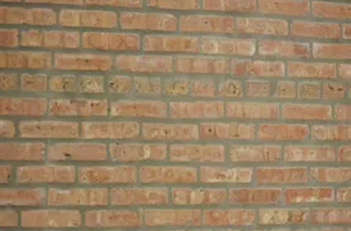 Brick wall with tuckpointing