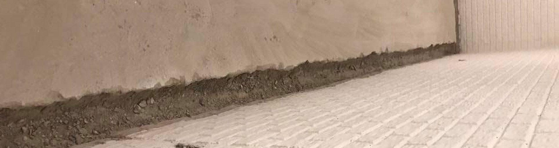 Basement wall meeting the floor after waterproofing has been performed
